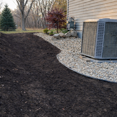 Landscape renovation preparation with freshly graded soil in Saint Charles Missouri